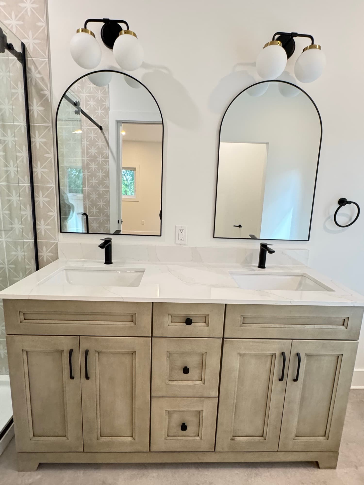 Ensuite double vanity with arched black mirrors